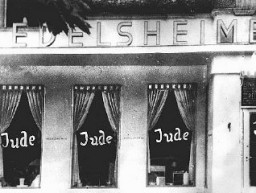 Windows of a Jewish-owned business in Berlin painted with the word "Jude" (Jew). Berlin, Germany, June 19, 1938.