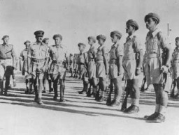 Brigadier Ernest Frank Benjamin, commanding officer of the Jewish Brigade, inspects the Second Battalion. Palestine, October 1944.
The Jewish Brigade Group of the British army, which fought under the Zionist flag, was formally established in September 1944. It included more than 5,000 Jewish volunteers from Palestine organized into three infantry battalions and several supporting units. 