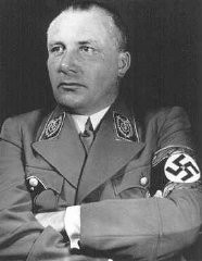Portrait of Nazi Party official Martin Bormann. Bormann died in an effort to flee Berlin in the last days of World War II, but was long thought to be at large. He was tried in absentia at the International Military Tribunal in Nuremberg, where he was sentenced to death.