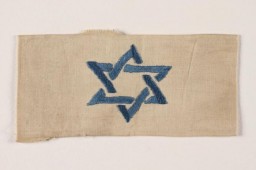 In December 1939, German authorities required Jews residing in the Generalgouvernement (which included Krakow) to wear white armbands with blue Stars of David for purposes of identification.
 
The armband pictured here was donated to the United States Holocaust Memorial Museum in 2001 by Akiva Kohane.
 