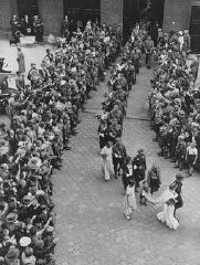 A mass marriage of 50 couples in Berlin. All of the couples belonged to the Nazi Party. Berlin, Germany, July 2, 1933.
