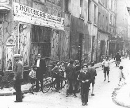 Street scene in the Jewish quarter of Paris before World War II and the Holocaust. Paris, France, 1933–39.