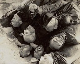 Close-up of corpses piled in the crematorium mortuary in the newly liberated Dachau concentration camp. Dachau, Germany, May 1945.
This image is among the commonly reproduced and distributed, and often extremely graphic, images of liberation. These photographs provided powerful documentation of the crimes of the Nazi era. 