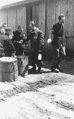 Prisoners receive meager food allocations at the Plaszow camp. Krakow, Poland, 1943 or 1944.