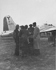 Haviva Reik and other parachutists from Palestine, under British command, sent to Slovakia to aid Jews during the Slovak national uprising. Hayim Hermesh (left), Haviva Reik (second from left), Rafi Reiss (behind Reik), Abba Berdichev (second from the right), and Zvi Ben-Yaakov (right), on the Tri Duby airfield before being sent to Slovakia. Czechoslovakia, September 1944.