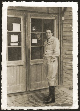 Jewish DP David Bromberg poses at the entrance to a barrack in the Ebensee displaced persons camp on October 30, 1946.