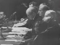 This footage comes from "Nuremberg, Its Lesson for Today" a 1947 documentary film produced by the US military's Documentary Film Unit, Information Services Division. The film, directed by Pare Lorentz and Stuart Schulberg, shows footage from the trial of Nazi war criminals by the International Military Tribunal. It also intermixes historical footage depicting the founding of the Nazi state, the unleashing of World War II, and Nazi crimes against humanity. The sentencing sequence shown here illustrates the incorporation of film clips used as evidence during the Nuremberg trial.