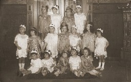 Group portrait of children dressed in Purim costumes. Danzig, 1930-1939.