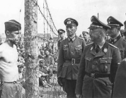 SS chief Heinrich Himmler (front, right) inspects a camp for Soviet prisoners of war. Minsk, Soviet Union, 1941.