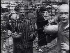 The Mauthausen concentration camp was established shortly after the German annexation of Austria (1938). Prisoners in the camp were forced to perform crushing labor in a nearby stone quarry and, later, to construct subterranean tunnels for rocket assembly factories. US forces liberated the camp in May 1945. In this footage, starving survivors of the Mauthausen concentration camp eat soup and scramble for potatoes.