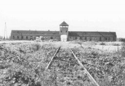 Main entrance to the Auschwitz-Birkenau killing center. This photograph was taken some time after the liberation of the camp in January 1945. Poland, date uncertain.
