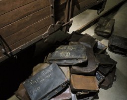 A collection of valises belonging to Jews who were deported to killing centers. These valises are displayed at the base of the railcar on the third floor of the Permanent Exhibition at the United States Holocaust Memorial Museum. Washington, DC, 1993–1995.