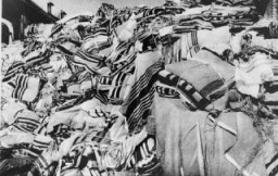 Piles of prayer shawls that belonged to Jewish victims, found after the liberation of the Auschwitz camp. Poland, after January 1945.