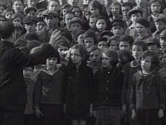 Large group of schoolchildren sing Hatikvah, the Zionist anthem.