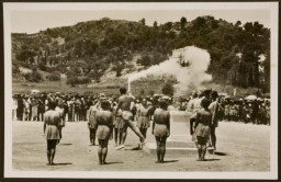 A runner begins the torch relay (the first "Olympia Fackel-Staffel-Lauf") in Oympia, Greece., ca. July 1936.
The 1936 Games were the first to employ the torch run. Each of 3,422 torch bearers ran one kilometer (0.6 miles) along the route of the torch relay from the site of the ancient Olympics in Olympia, Greece, to Berlin. Former German Olympian Carl Diem modeled the relay after one that had been run in Athens in 80 B.C. It perfectly suited Nazi propagandists, who used torchlit parades and rallies to attract Germans, especially youth, to the Nazi movement.

 