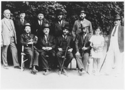 Leaders of the Sighet Jewish community. Those pictured include Mr. Hershkovich (seated far left), Mr. Klein (seated second from left), Mr. Yacobovich (standing far right), and Mr. Jahan (standing second row, right). Photograph taken ca. 1928–1930.