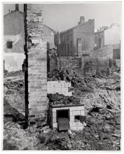 A bombed out home in Warsaw, the besieged capital of Poland. Only a chimney and a stove remain relatively intact. Photograph taken by Julien Bryan (1899-1974), a documentary filmmaker who filmed and photographed the everyday life and culture of individuals and communities in a variety of countries around the globe. In Warsaw following the German invasion of Poland, Bryan filmed and photographed the German bombardment and its impact on the Polish citizenry. He was able to leave during a brief truce that was negotiated to allow citizens of neutral countries to evacuate. Bryan was able to bring his films out, though for a time he got separated from his suitcase of film and thought they were lost. 
 