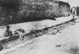 Armenian children lie in the street of an unidentified town. Photograph taken by Armin T. Wegner. Wegner served as a nurse with the German Sanitary Corps. In 1915 and 1916, Wegner traveled throughout the Ottoman Empire and documented atrocities carried out against the Armenians. [Courtesy of Sybil Stevens (daughter of Armin T. Wegner). Wegner Collection, Deutsches Literaturarchiv, Marbach & United States Holocaust Memorial Museum.]