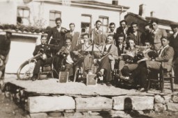 A group of Macedonian Jewish youth, members of a band, pose with their instruments on a makeshift stage in Bitola. [LCID: 97823]