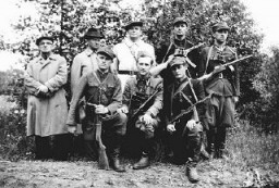 General Michael (Rola) Zymierski (top row, center), commander of the Polish communist Armia Ludowa, poses with a partisan unit in the Parczew Forest. The partisan unit includes the Jewish physician, Michael Temchin (bottom right).