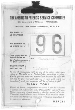 Identification tag issued to Liesel Weil by the American Friends Service Committee for her voyage to the United States on board the Mouzinho. More than 100 children sailed to New York aboard the Mouzinho, a Portuguese liner. The transport was sponsored by the American Friends Service Committee, and representatives of several Jewish organizations met the children in New York. Marseille, France, 1941.