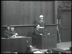 Albert Speer gives testimony at the International Military Tribunal. In 1942 Speer was named Minister of Armaments and Munitions, assuming significant responsibility for the German war economy. In this position, Speer used millions of forced laborers to raise economic production.