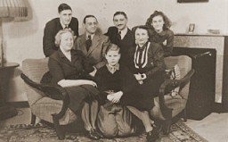 The Jacobsthal family poses with an aunt and uncle who are visiting their home in Amsterdam before emigrating to Chile. Amsterdam, The Netherlands, February 1938.