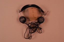 Headphones used by defendant Hans Frank during the International Military Tribunal. Headphones like these enabled trial participants to hear simultaneous translation of the proceedings.
