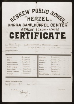 This report card was issued to Regina Laks, a fifth-grade student at the Herzel Hebrew Public School at the Düppel Center displaced persons camp.