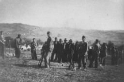 Ustaša (Croatian fascist) soldiers oversee the deportation of a group of civilians from Kozara region to a concentration camp, in the pro-German fascist state of Croatia established following the partition of Yugoslavia. Croatia, between 1941 and 1944.