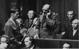 On September 15, 1947, defendant Paul Blobel pleads not guilty during his arraignment at the Einsatzgruppen Trial. Blobel was the commander of the unit responsible for the massacre at Babi Yar (near Kiev). He was convicted by the military tribunal at Nuremberg and sentenced to death. Blobel was hanged at the Landsberg prison on June 8, 1951.
