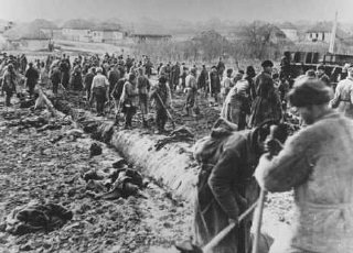 Soviet prisoners of war build a road. Probably in the Soviet Union, about 1943.