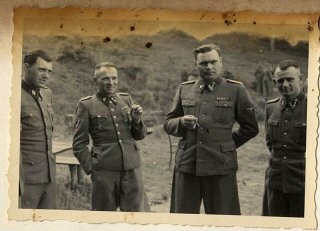 Left to right: Dr. Josef Mengele, Rudolf Höss, Josef Kramer, and an unidentified officer.