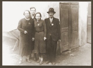 Portrait of the Weidenfeld family wearing Jewish badges in the Czernowitz ghetto