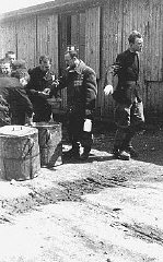 Prisoners receive meager food allocations at the Plaszow camp.