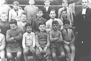 Portrait of a boarding school class in which a Jewish boy was hidden.