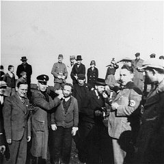 Germans humiliate religious Jews in Tarnow. Poland, 1940.