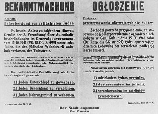 A Nazi decree issued in October 1941, in German and Polish, warns that Jews leaving the ghetto, or Poles who aid them, will be executed.